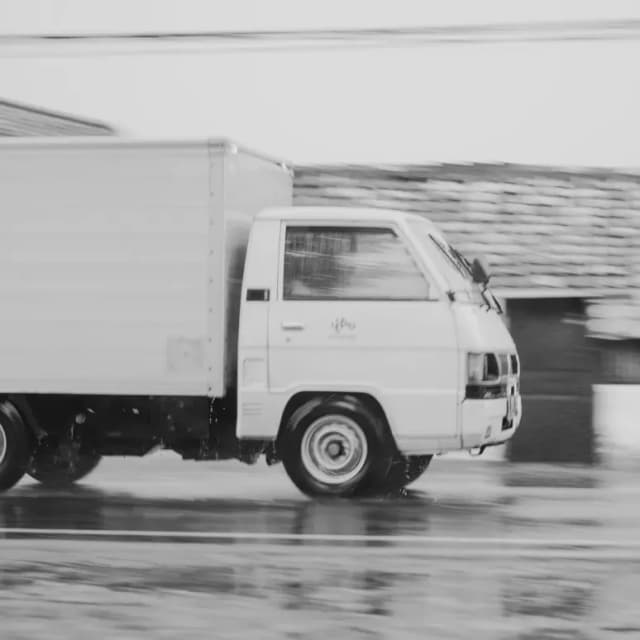 White delivery truck in motion