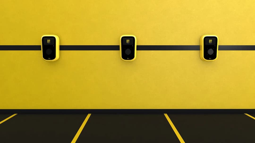 Electric vehicle charging stations on yellow wall