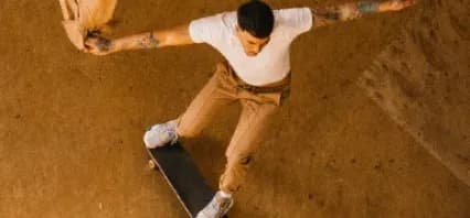 Skateboarder performing a trick in a bowl