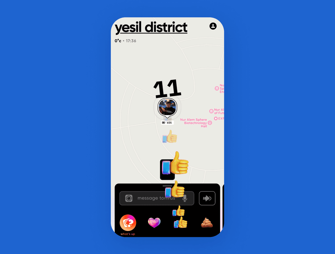 Social map app 'yesil district' showing a friend's location, battery status and thumbs-up stickers