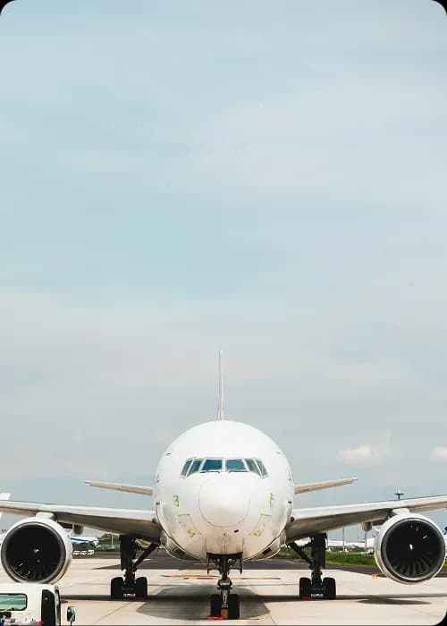 Airplane on runway facing the camera