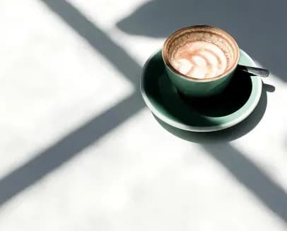 Coffee cup on a saucer with shadow