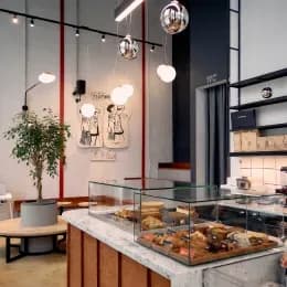 Café interior with display case and seating