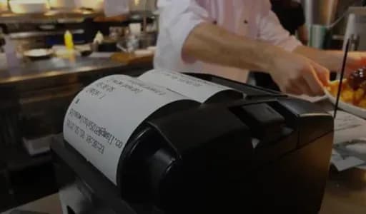 Receipt printer in a restaurant kitchen
