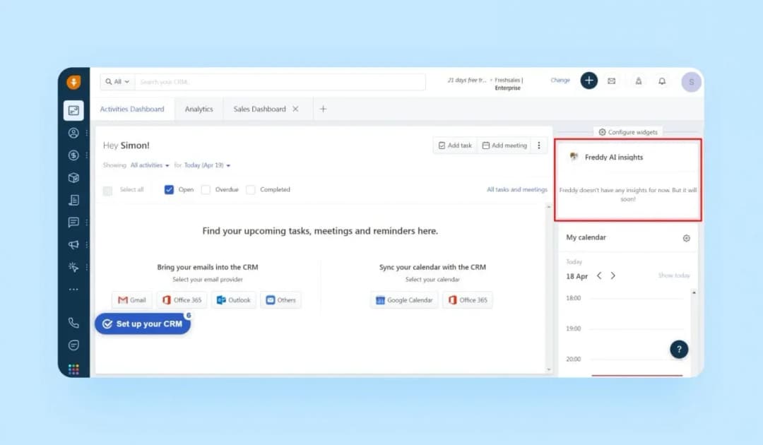 Freshworks CRM sales dashboard with a Freddy AI insights widget and CRM setup prompts