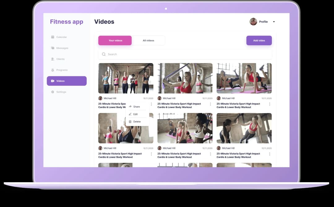 Laptop screen displaying a fitness app videos section with workout thumbnails and menu options.