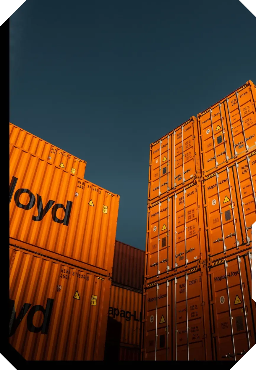 Shipping containers stacked in a storage area