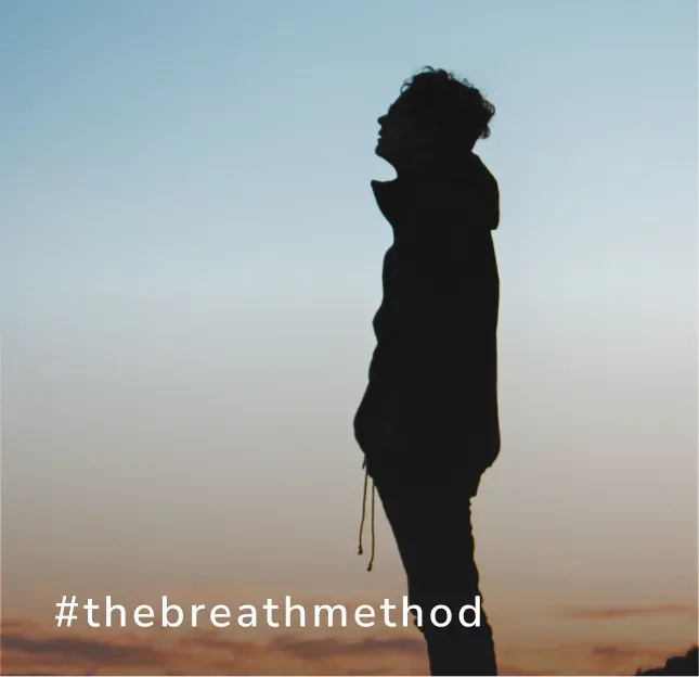 Silhouette of a person against sunset sky