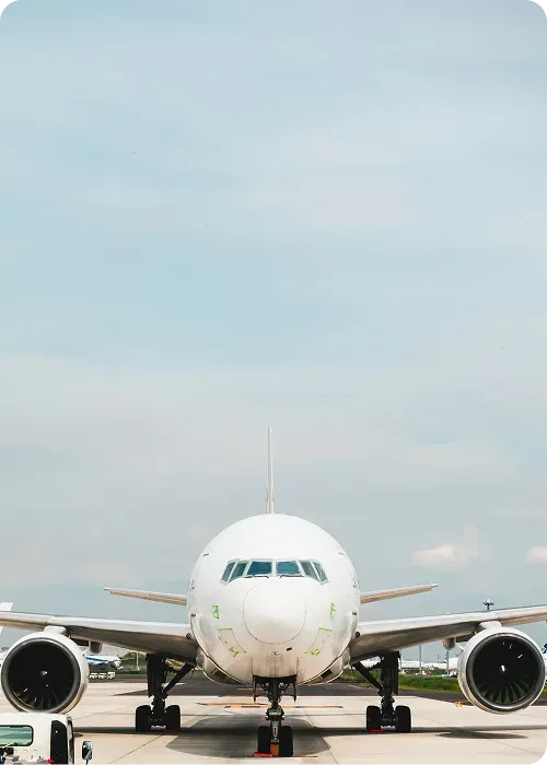 Airplane on runway facing the camera