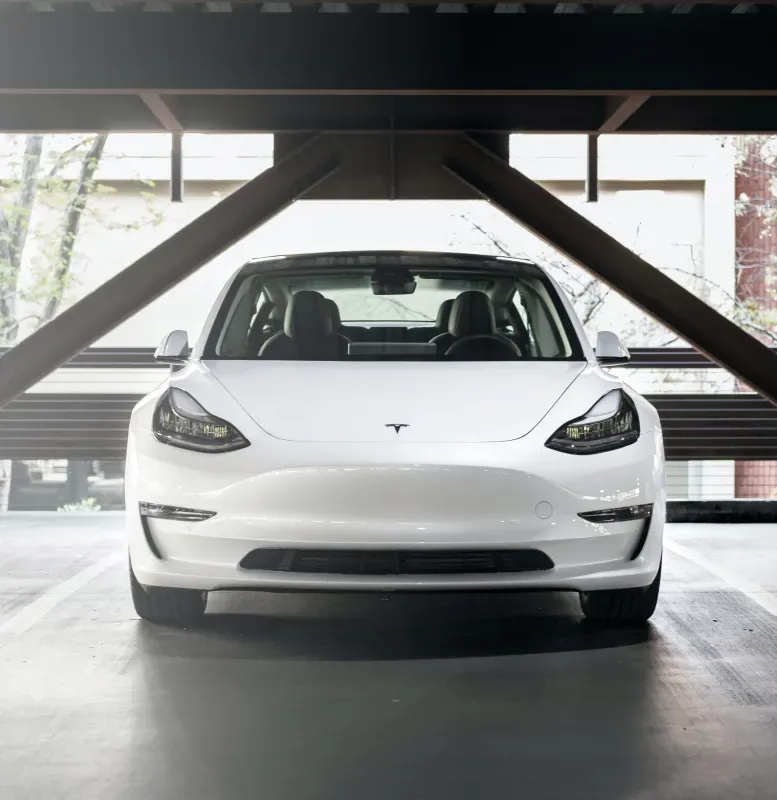 White Tesla Model 3 parked indoors