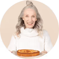 Portrait of person holding a cake